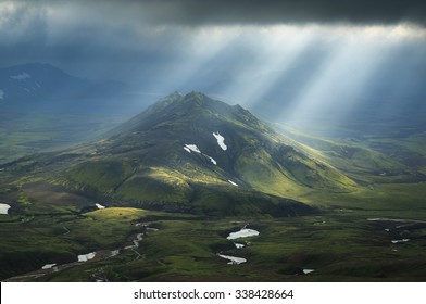 Sun Breaking Through The Clouds On A Mountain On The Laugavegur Hiking Trail On Iceland.