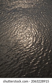 The Sun, Breaking Through The Clouds, Is Reflected In The Bed Of A Mountain River. Natural Natural Background.