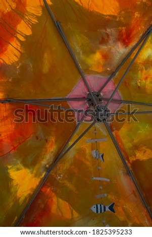 a sun brolly in a town square