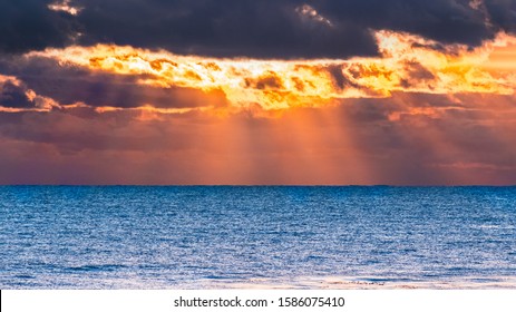 Sun Bursting Through Storm Clouds Sunset Stock Photo 1586075410 ...