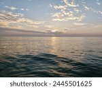 Sun casting reflections across water during late afternoon at St Pete Beach