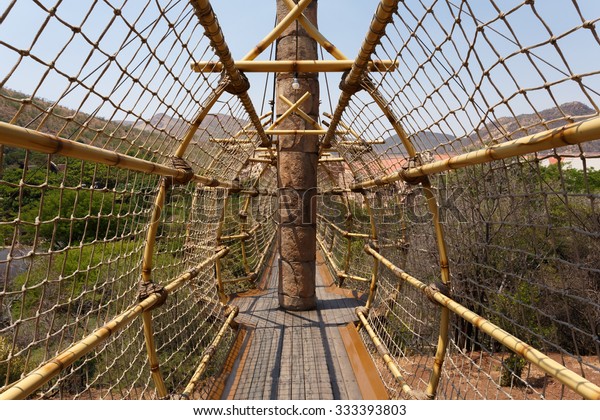 SUN CITY, SOUTH AFRICA - OCTOBER\
29: Suspension rope bridge, entry to maze, one of tourist atraction\
in luxury resort on 29 October in Sun City, South\
Africa