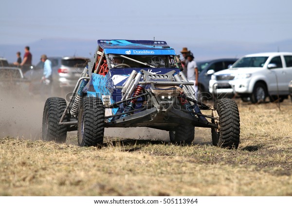 Sun City, South Africa - OCTOBER\
1, 2016: Front view of Speeding Blue Bat Spec 0 rally car in race\
at Sun City 450 Rally Racing event, Sun City, South Africa \
