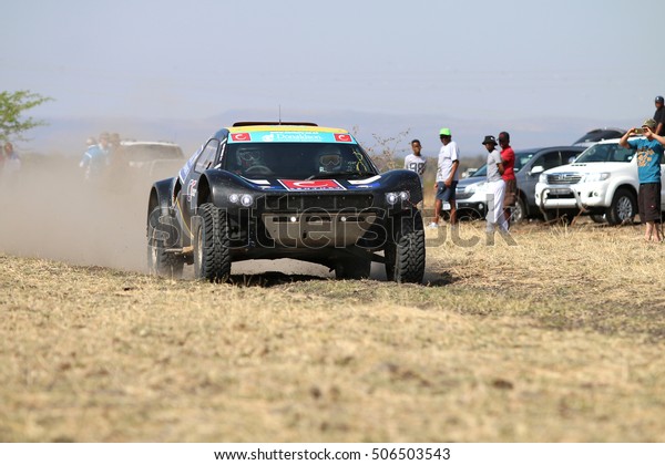 Sun City, South Africa - OCTOBER 1,\
2016: Front view of Speeding black CR-2 rally car in race at Sun\
City 450 Rally Racing event, Sun City, South Africa \

