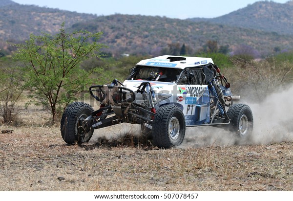 Sun City,
South Africa - OCTOBER 1, 2016: Forty Five degree close-up view of
Speeding white Zarco rally car in race at Sun City 450 Rally Racing
event, Sun City, South Africa 
