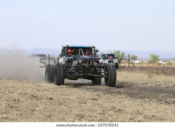 Sun City, South Africa - OCTOBER 1,
2016: Front view of Speeding black Porter rally car in race at Sun
City 450 Rally Racing event, Sun City, South Africa 
