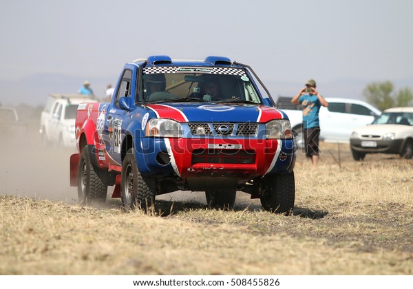 Sun City,\
South Africa Ã¢?? OCTOBER 1, 2016: Front view of Speeding red and\
blue Toyota Nissan single cab rally car in race at Sun City 450\
Rally Racing event, Sun City, South Africa \
