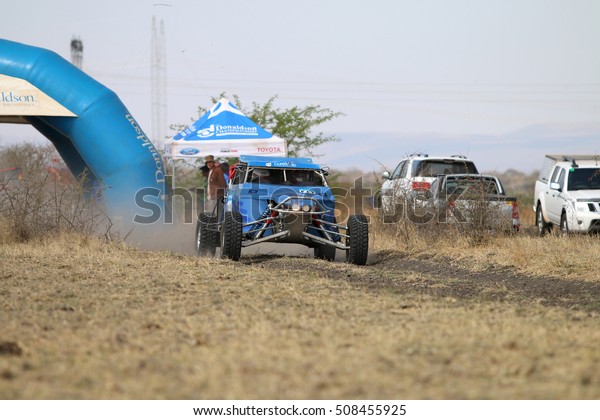 Sun City, South Africa Ã¢?? OCTOBER 1,
2016: Speeding blue Zarco rally car at start of race at Sun City
450 Rally Racing event, Sun City, South Africa 
