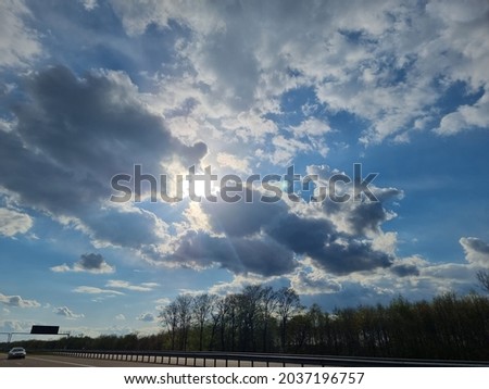 sun and clody in spring + highway 