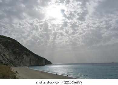 Sun And Cloud Over Mylos Beach Near Agios Nikitas On North West Corner Of Lefkada Island, Greece