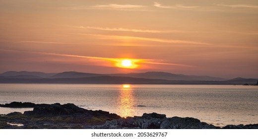Sun coming up over Tullagh Bay on the Inishowen peninsula in county Donegal Ireland