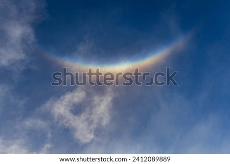 The sun conjures up a helo in the ice fog as a circumzenithal arches 