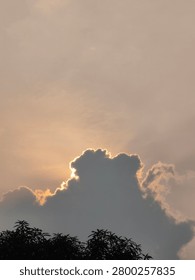 The sun was covered by thick clouds, The sky was cloudy with white clouds blocking the sun's rays