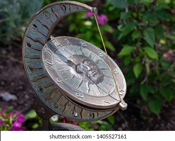 Sun Dial In Garden With Patina