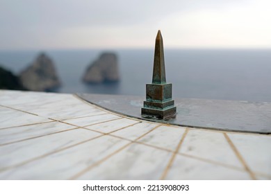 Sun Dial On Capri, Italy, With The Sea In The Background