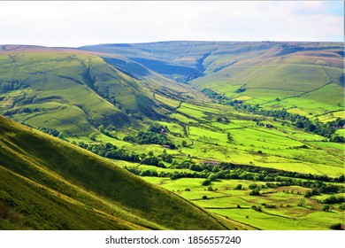 The sun drenched Edale Valley in Derbyshire with Kinder Scout in the background