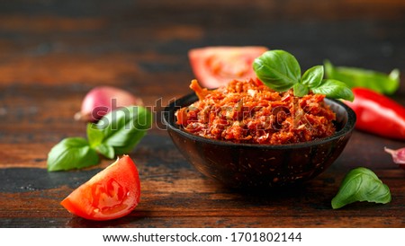 Sun dried tomato pesto with chilli, garlic and herbs in bowl