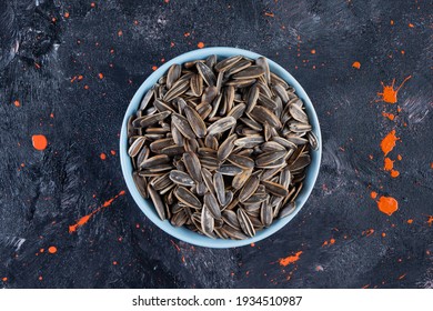 Sun Flower Seeds In Bowl Over Dark Background. High Quality Photo