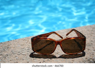 Sun glasses by the pool