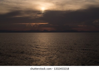 Sun going down behind clouds