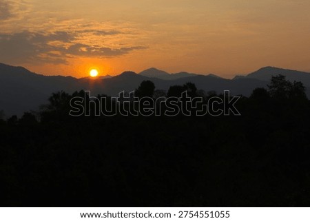 The sun has risen above the mountaintops.
