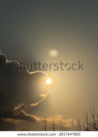 The sun is hiding behind a cloud.