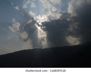 Sun hiding behind clouds