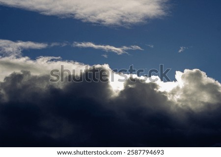 Similar – Image, Stock Photo The sun hides behind the clouds as we go to bed