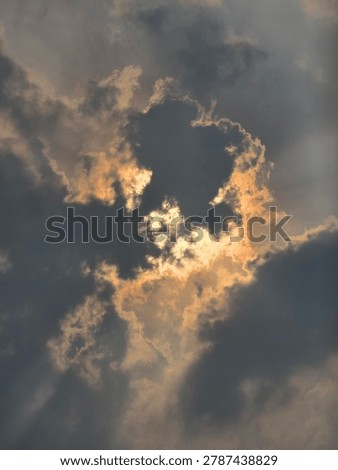 The sun hiding behind the clouds 
