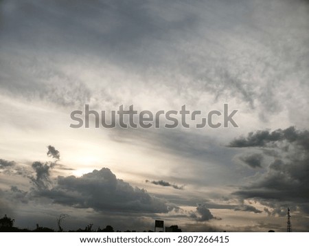 The sun hiding behind the clouds