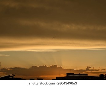 Sun hiding behind clouds  during sunset