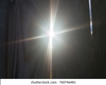 Sun Light Shining Through Crack In Wood Fence