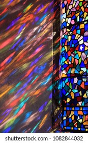 Sun Light Streaming Through A Stained Glass Window In Sussex, UK