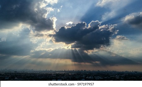 sun light  through cloud blue sky town background 