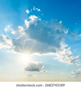 Sun light through cloud on blue sky. Blue sky, clouds and sun light