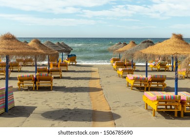 Sun Loungers On A Beach On The Costa Del Sol, Spain