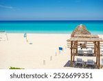 Sun loungers on the shores of the Anlantic Ocean in the city of Varadero on the island of Cuba