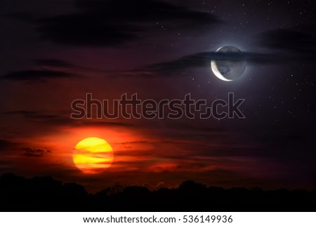Sun and moon together on the sky symbolizing time, opposites, balance etc