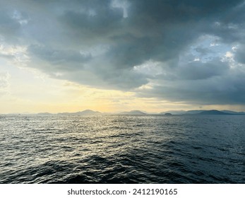 Sun ocean and more clouds