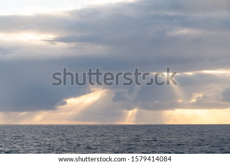 Similar – Image, Stock Photo Sunrise over Ocean Through Black Window Panes