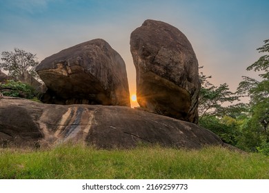 The sun peaking through the rocks.