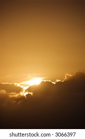 Sun peeking through cloud.
