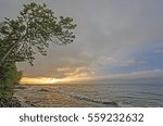 Sun Peeking Through the Clouds on the Lakeshore of Lake Superior in Porcupine Mountains State Park in Michigan