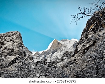 sun ray from behind of snow mountain