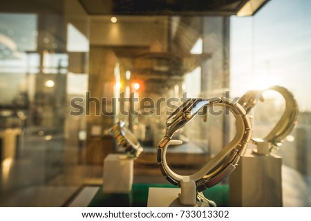 Sun ray on luxury watches displayed in shop exposition