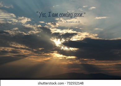 Sun rays beaming through clouds with a bible verse from the book of Revelation - Shutterstock ID 732552148