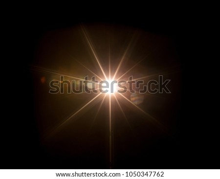 Sun rays beams texture, isolated on black background.