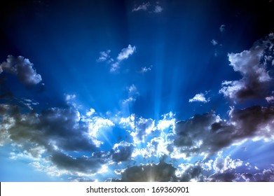 Sun Rays Behind Clouds After A Storm