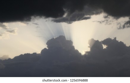 sun rays between the clouds before storm