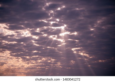 Sun rays breaking through clouds